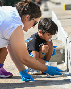 Let's Green NYC Initiative - volunteers paint the steps in a park